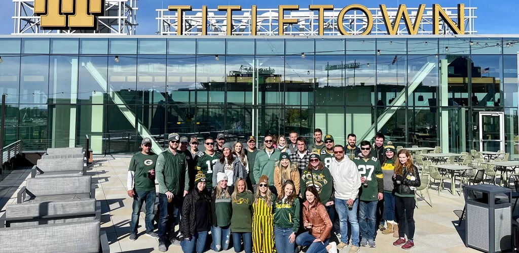 Krause Group staff at a company tailgate at the Titletown Tech building near Lambeau Field